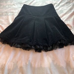 Girls black velvet skirt with adjustable waist.